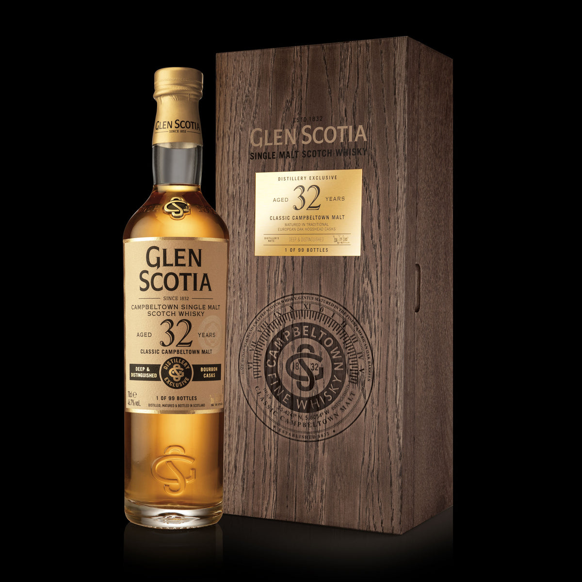 A bottle of Glen Scotia 32 Year Old Single Malt Scotch Whisky, hailed as a rare liquid, is showcased alongside its dark wooden box. The label and box inscriptions highlight its age and provenance. Both are arranged against a black background, radiating elegance and prestige.