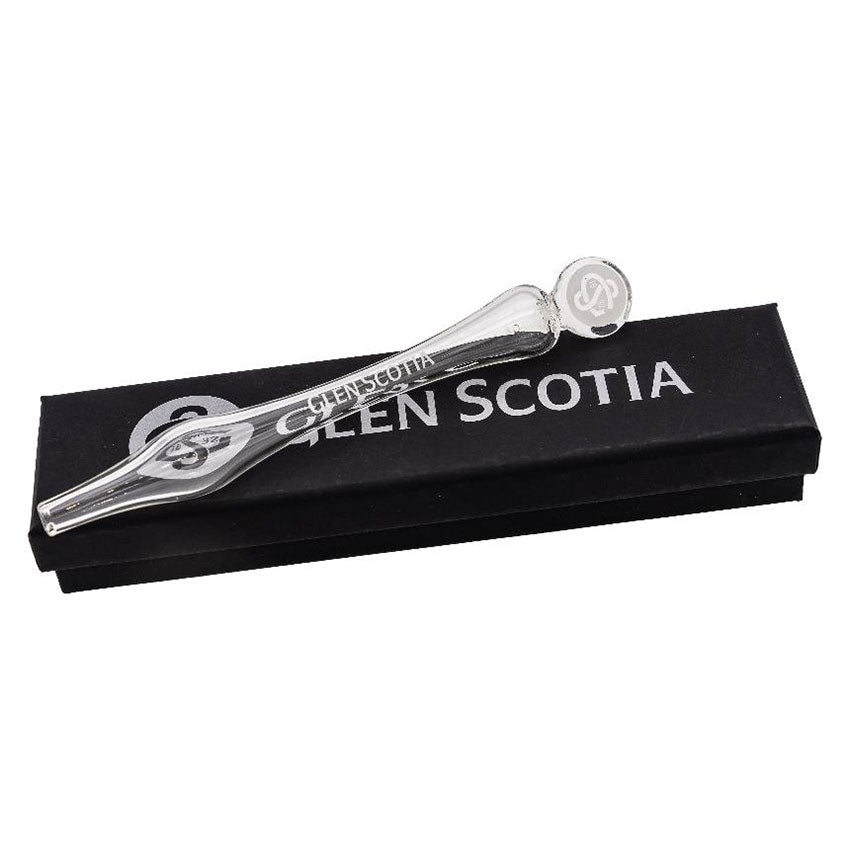 Displayed on a black box with &quot;GLEN SCOTIA&quot; written in white text, the Water Dropper features a transparent glass pipette with a decorative rounded end embossed with a logo. Perfect for whisky enthusiasts, this Water Dropper and its accompanying box showcase a sleek, elegant design brought to you by Glen Scotia.