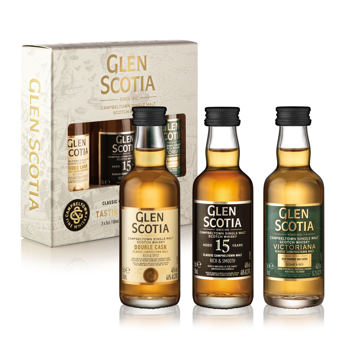 A Whisky Miniatures Gift Set from Glen Scotia, featuring three single malt whisky bottles with unique labels, is elegantly displayed in front of a branded tasting gift box. The box showcases the Glen Scotia logo along with product details. This Campbeltown collection includes the Double Cask, 15 Years Old, and Victoriana varieties.